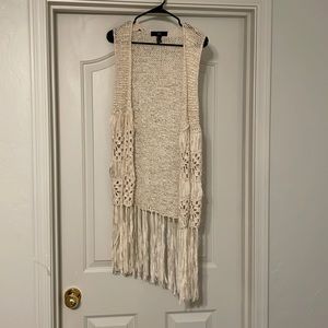 Cream colored sleeveless cardigan, size medium. Like new!